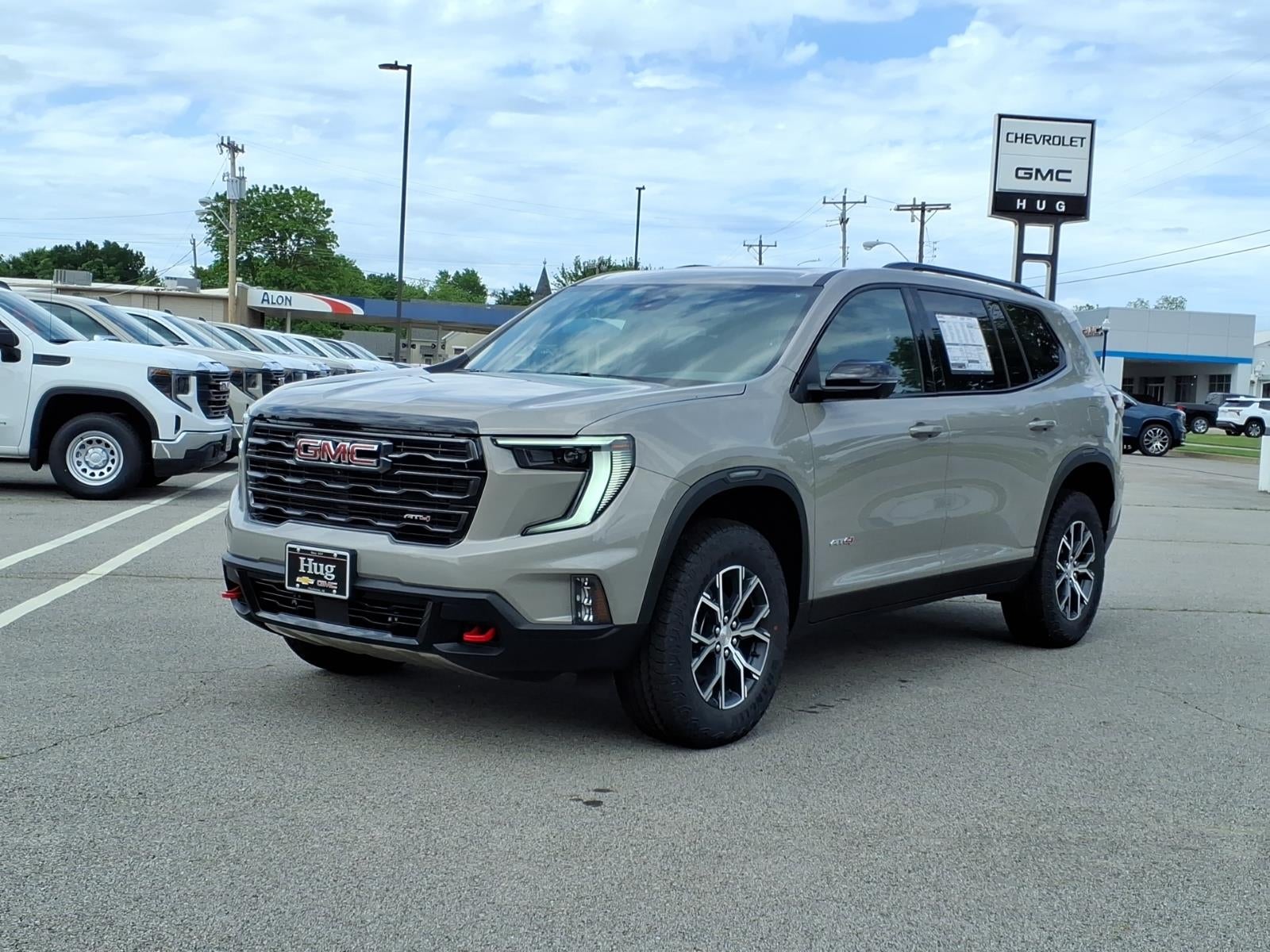 2026 GMC Acadia AT4 in Riverstone Metallic — front three-quarter view